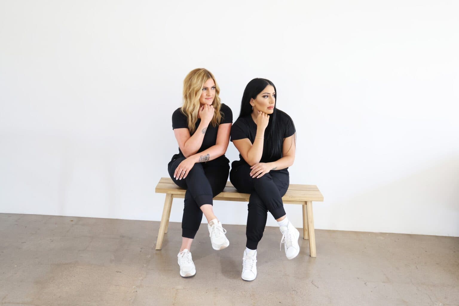 Rachael and Erica seated together in their studio